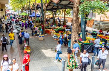 sidewalk with bustling street markets