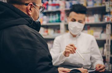 pharmacist reviewing medications with a patient