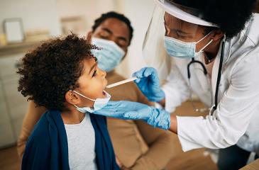 child receiving care from health professionals