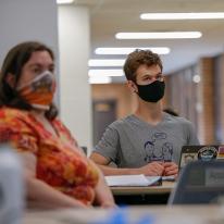 Masked people in UMN building