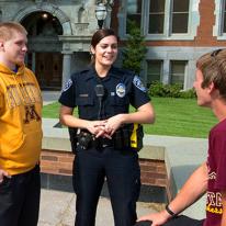 police officer on campus with people